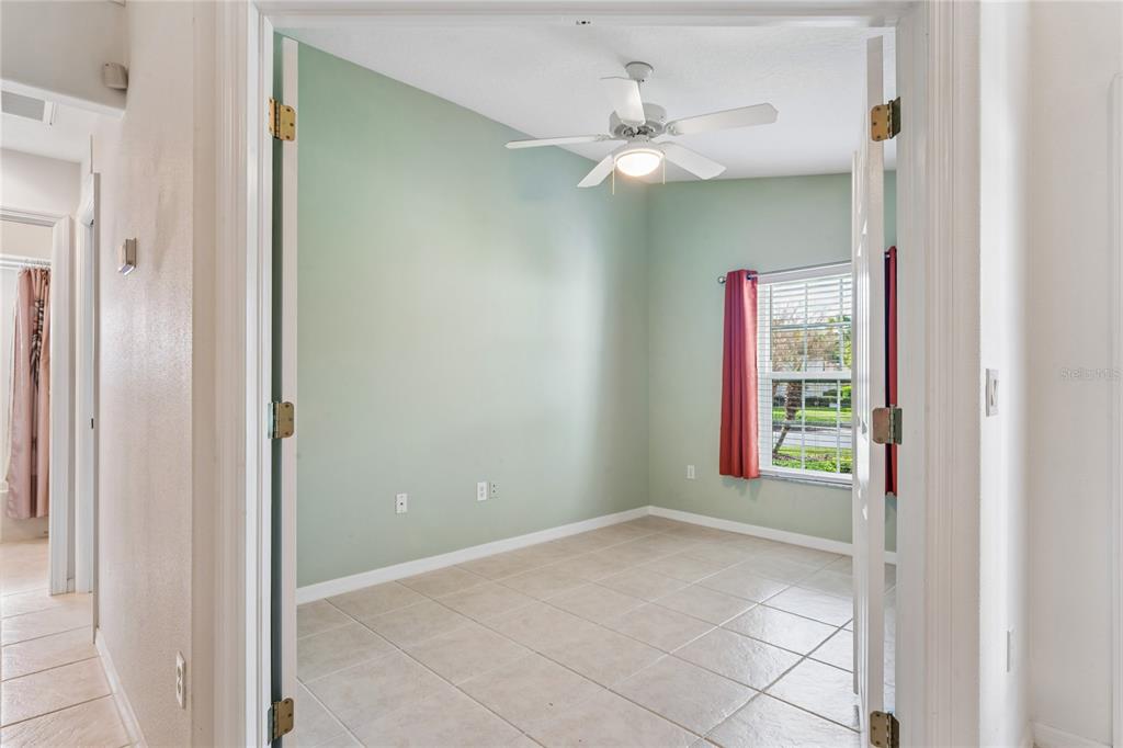 11330 Leeds Drive Spring Hill, FL 34609 - Photo 30 of 78 a view of an empty room with window chandelier fan