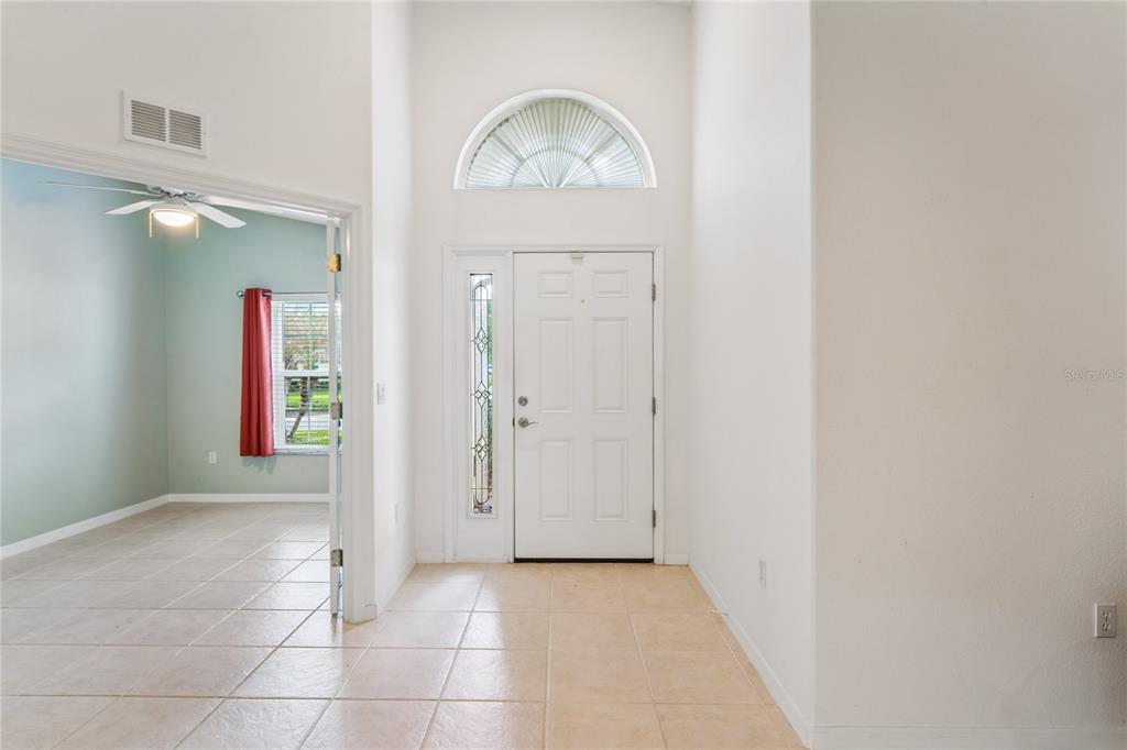 11330 Leeds Drive Spring Hill, FL 34609 - Photo 3 of 78 an empty room with mirror and a window