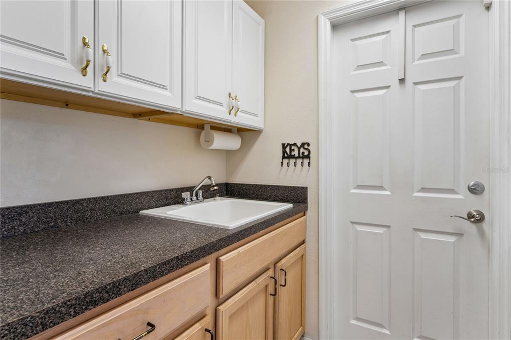 11330 Leeds Drive Spring Hill, FL 34609 - Photo 34 of 78 a kitchen with a sink and cabinets