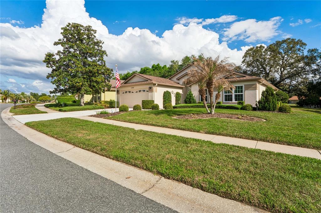 11330 Leeds Drive Spring Hill, FL 34609 - Photo 48 of 78 a front view of a house with a yard