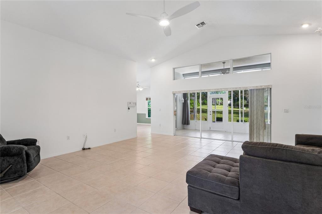11330 Leeds Drive Spring Hill, FL 34609 - Photo 5 of 78 a living room with furniture and a large window