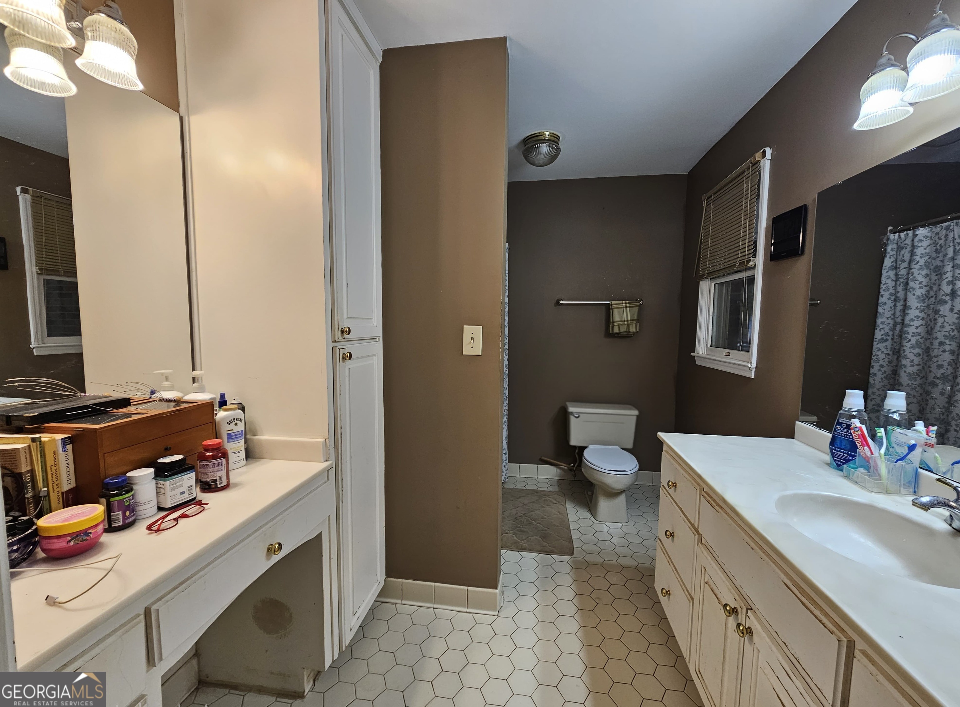 228 Honeysuckle Road Monticello, GA 31064 - Photo 24 of 35 a bathroom with a double vanity sink mirror and toilet