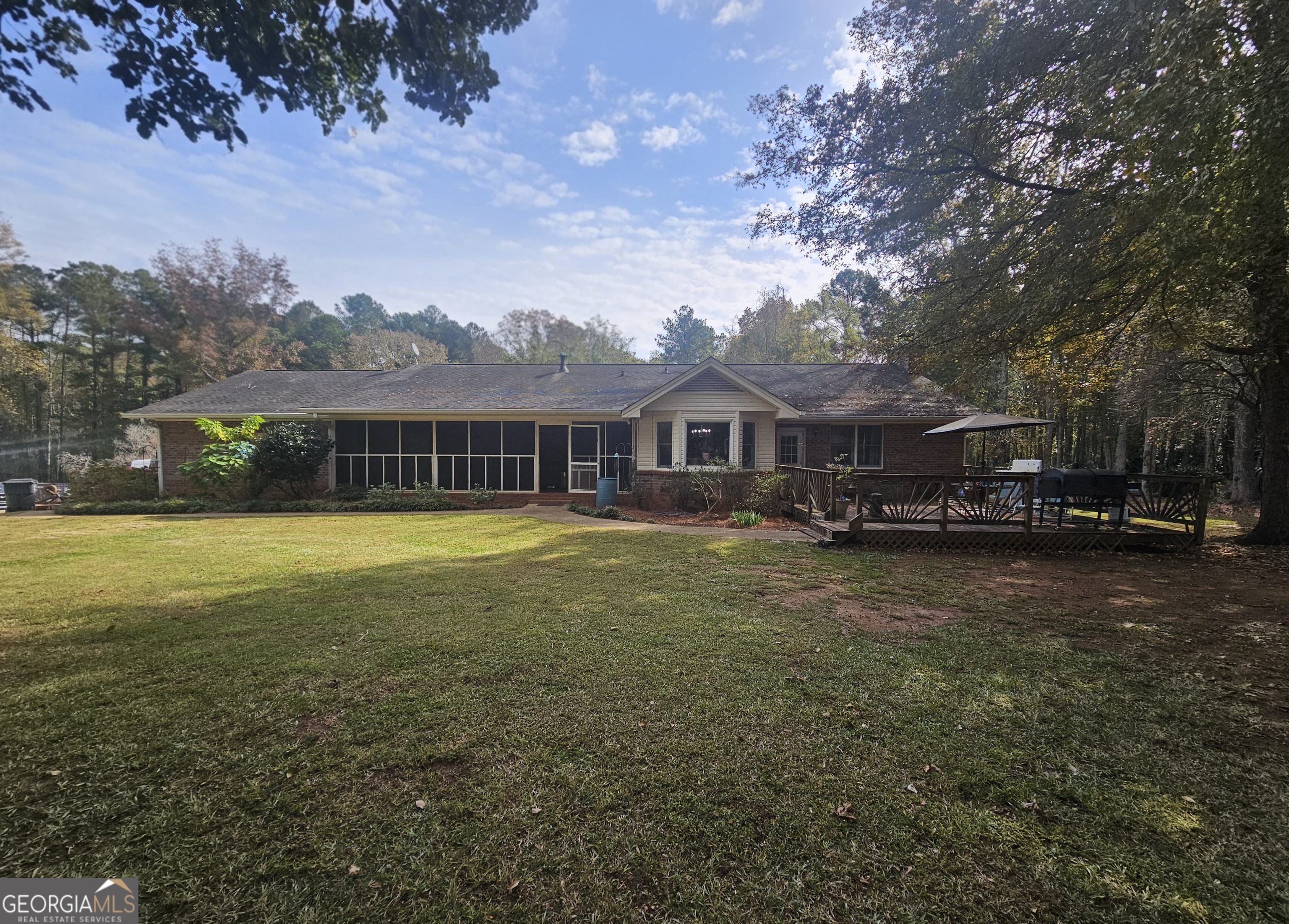 228 Honeysuckle Road Monticello, GA 31064 - Photo 25 of 35 a front view of a house with a garden