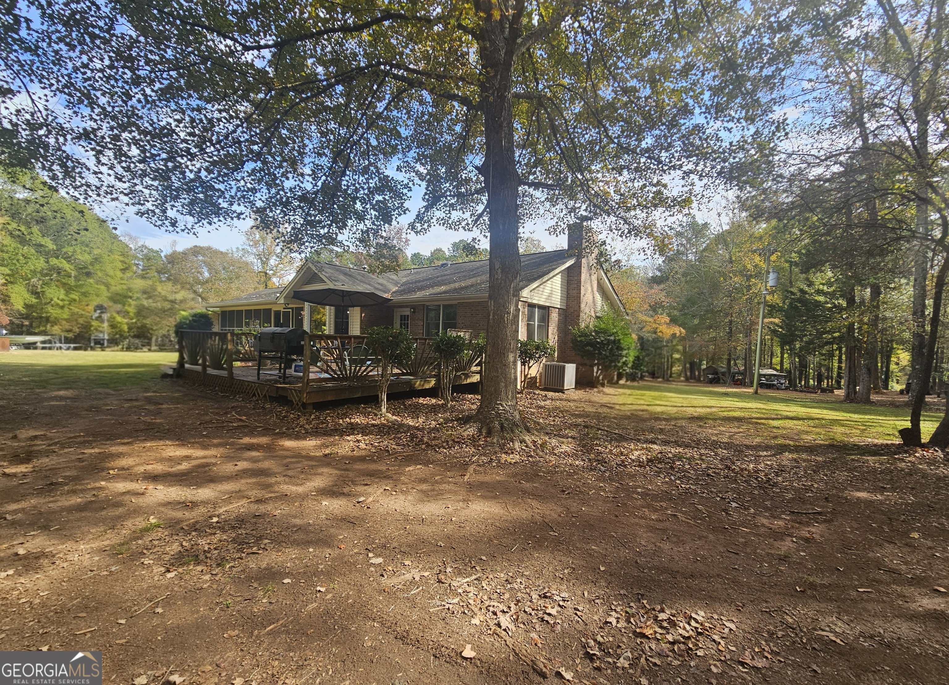 228 Honeysuckle Road Monticello, GA 31064 - Photo 27 of 35 a view of a house with large trees