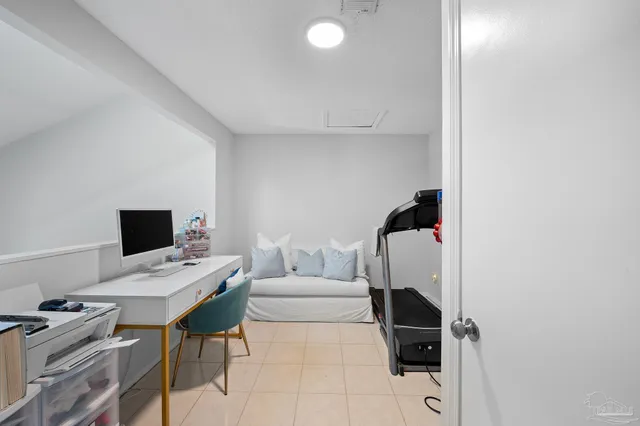 a workspace with furniture and white wall