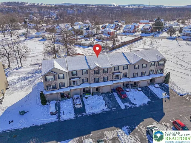 an aerial view of a house with roof deck