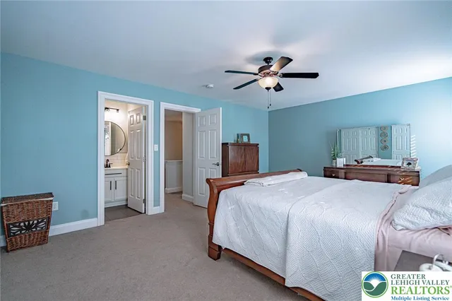 a bathroom with a sink a mirror a toilet and a shower