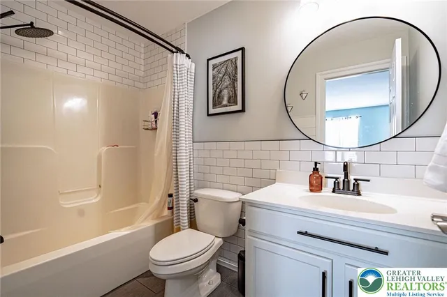 a bedroom with bed and a window