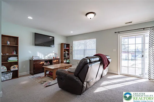 a view of a backyard with sitting area