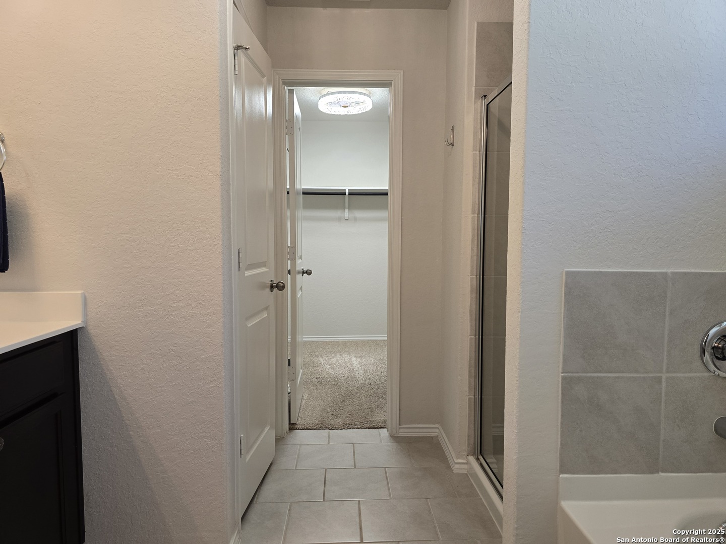 8207 Tortoise Trail Converse, TX 78109 - Photo 17 of 30 a bathroom with a shower and a sink