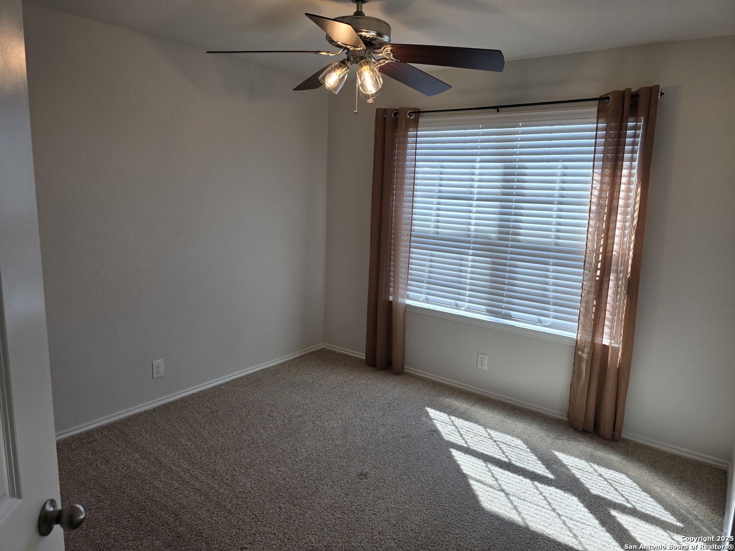 8207 Tortoise Trail Converse, TX 78109 - Photo 6 of 30 a view of an empty room with a window