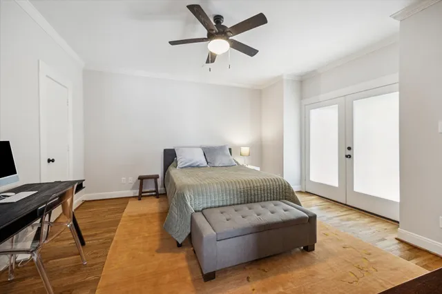 a bedroom with a bed and window