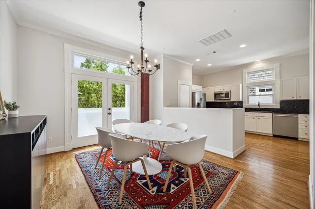 a view of a dining room with furniture window and wooden floor