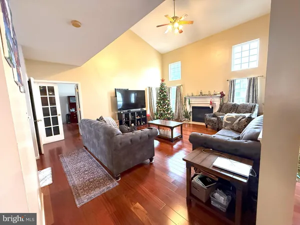 a living room with furniture fireplace and a flat screen tv