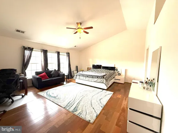 a living room with a bed and furniture