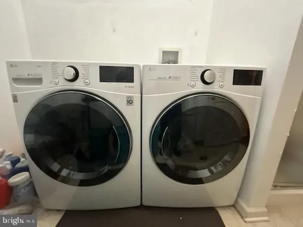 a utility room with dryer and washer