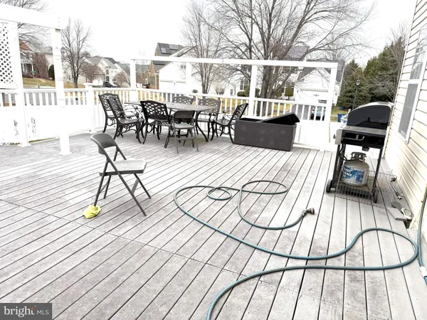 a view of outdoor space with lots of furniture and wooden floor