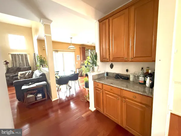 a kitchen with sink refrigerator and cabinets