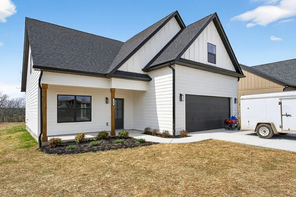 a view of garage with a small barn