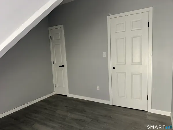 a picture of a room with a bench