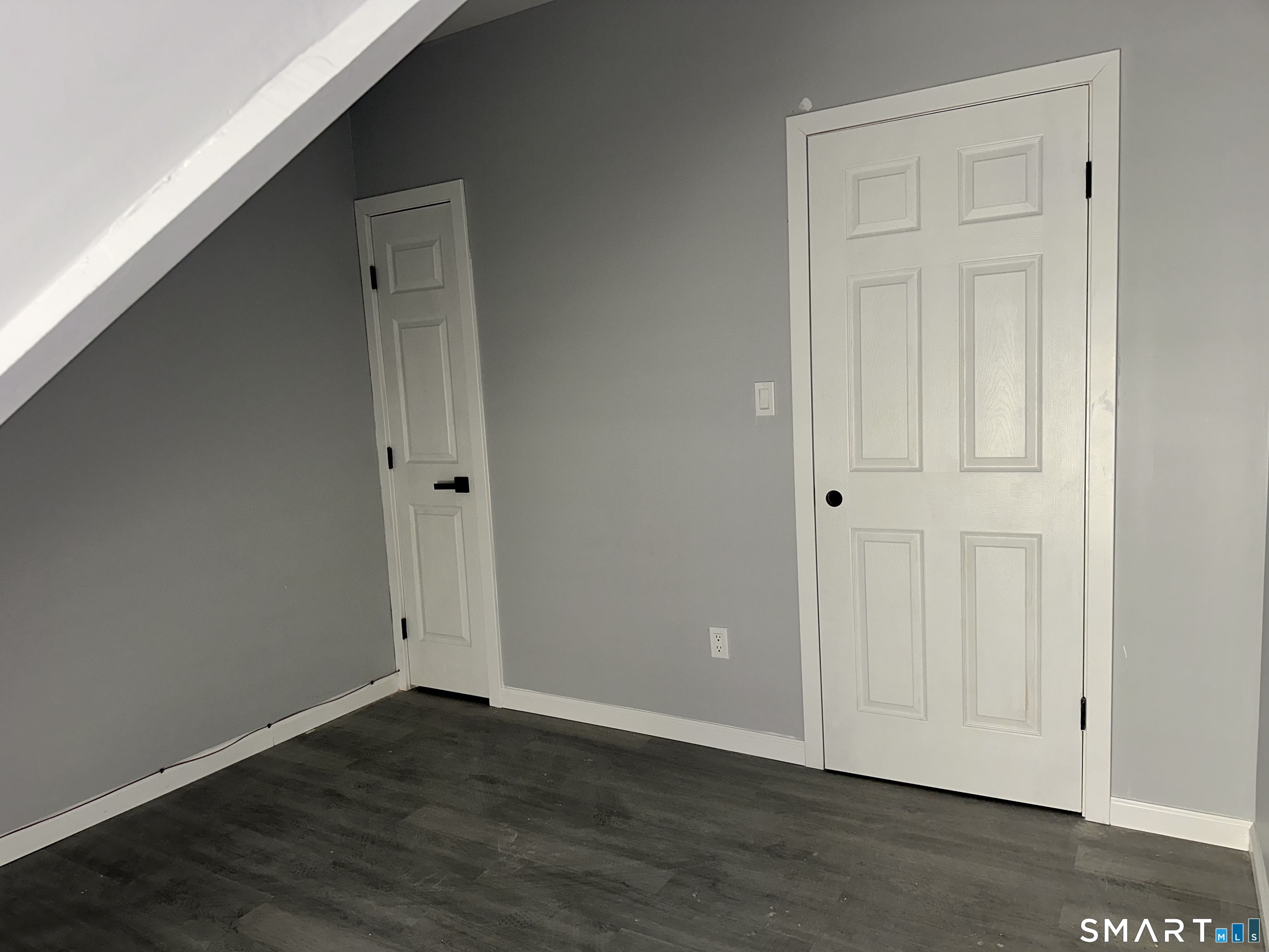 240 Madison Avenue Bridgeport, CT 06604 - Photo 19 of 21 a view of an empty room with wooden floor