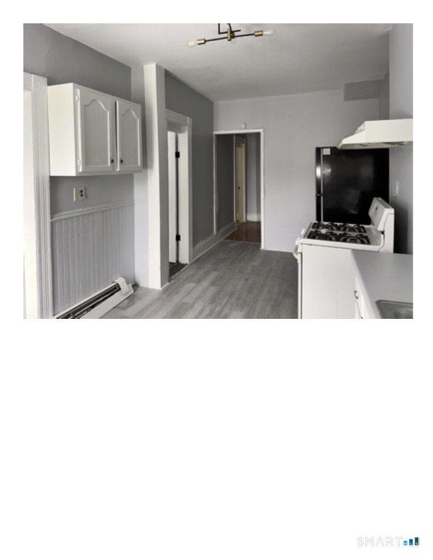 240 Madison Avenue Bridgeport, CT 06604 - Photo 4 of 21 a kitchen with stainless steel appliances kitchen island sink refrigerator and stove