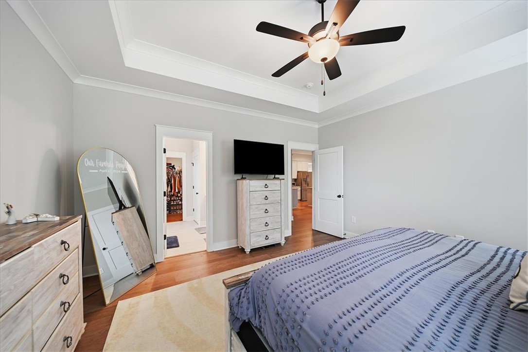 214 Timothy Court Anderson, SC 29621 - Photo 26 of 43 A tray ceiling and hardwood flooring define this tranquil sleeping space, with ample natural light.