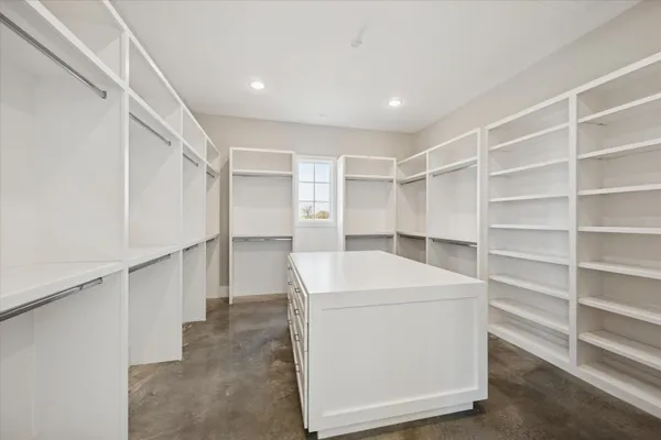a utility room with cabinets washer and dryer