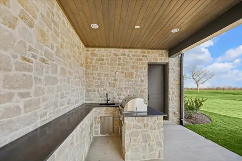 a view of a patio with a yard