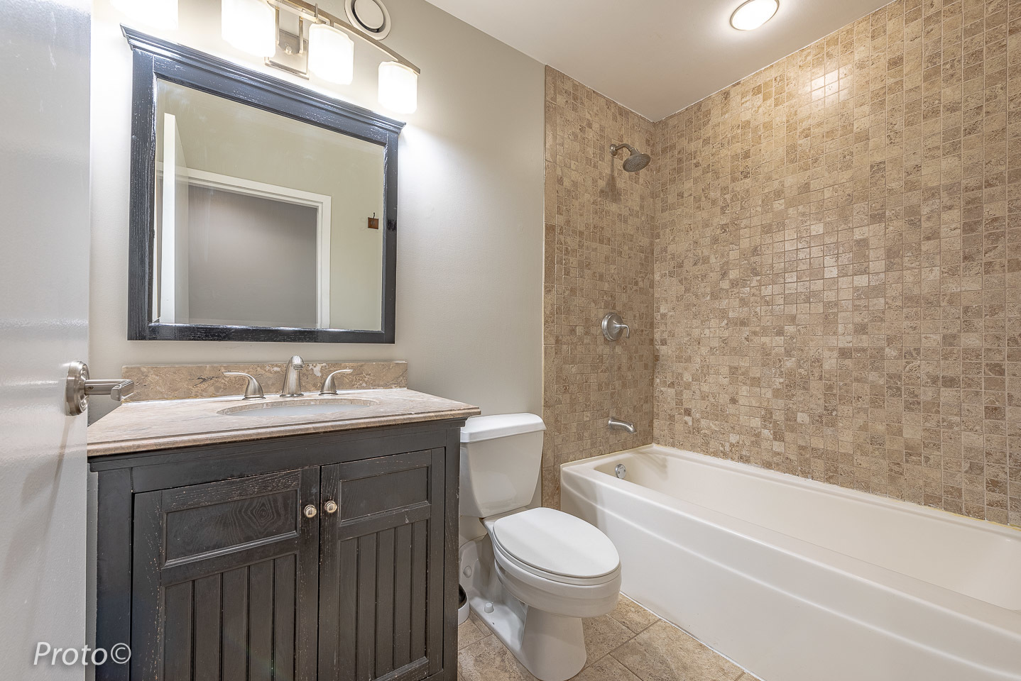 20 North State Street, Unit 1012 Chicago, IL 60602 - Photo 21 of 26 a bathroom with a toilet a sink a mirror a bathtub and vanity