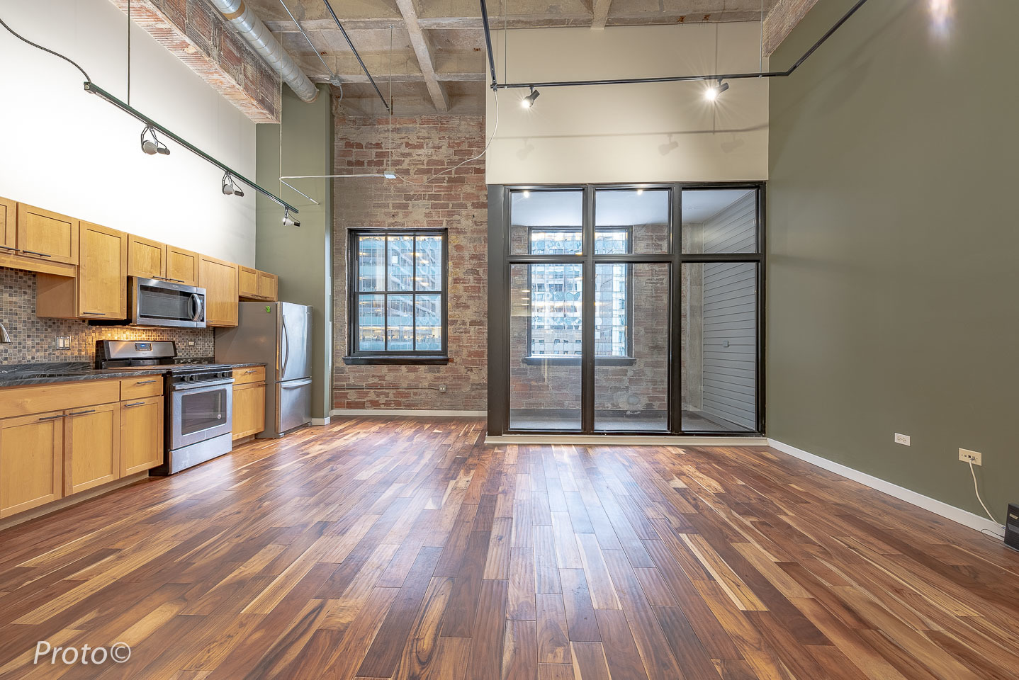 20 North State Street, Unit 1012 Chicago, IL 60602 - Photo 4 of 26 a view of a kitchen with wooden floor and electronic appliances