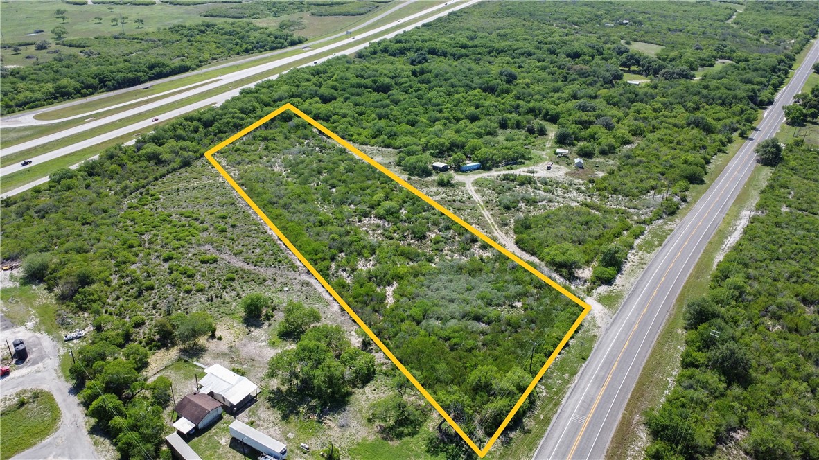 906 Fm 3024 Mathis, TX 78380 - Photo 11 of 25 a view of a yard with a wooden fence