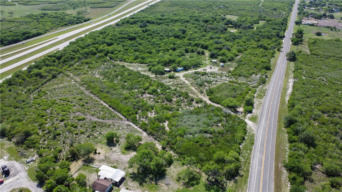 906 Fm 3024 Mathis, TX 78380 - Photo 12 of 25 a view of a green yard with large trees