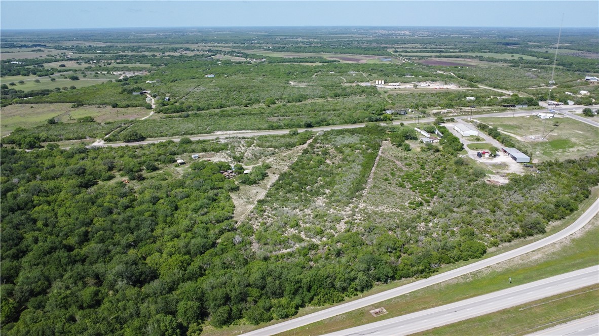 906 Fm 3024 Mathis, TX 78380 - Photo 15 of 25 an aerial view of residential houses with outdoor space and trees