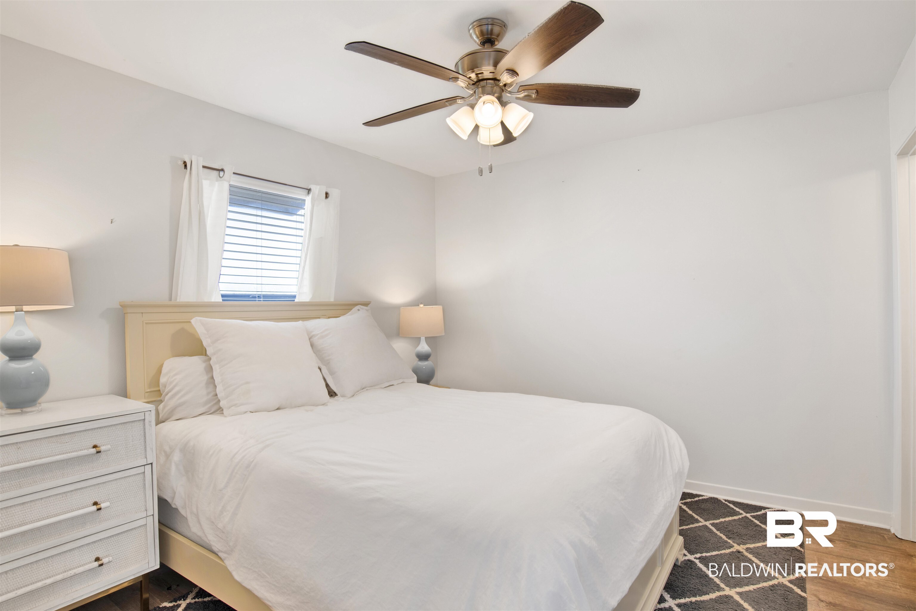 26913 Marina Road, Unit 213 Orange Beach, AL 36561 - Photo 19 of 30 Bedroom with hardwood / wood-style floors and ceiling fan