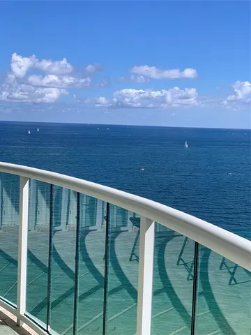 a balcony with an ocean view