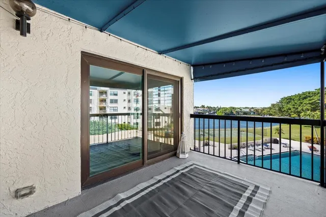 a view of a swimming pool with a patio