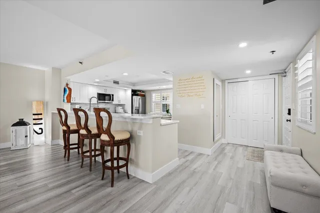 a large kitchen with stainless steel appliances granite countertop a stove and a sink