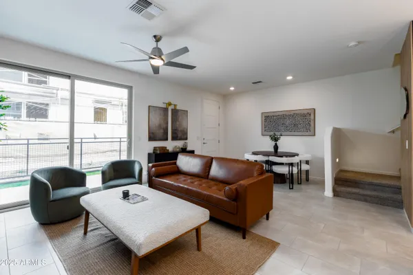 a living room with furniture and a large window