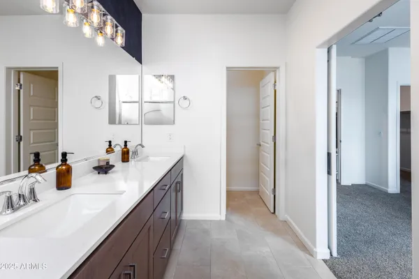 a bathroom with a sink vanity and mirror