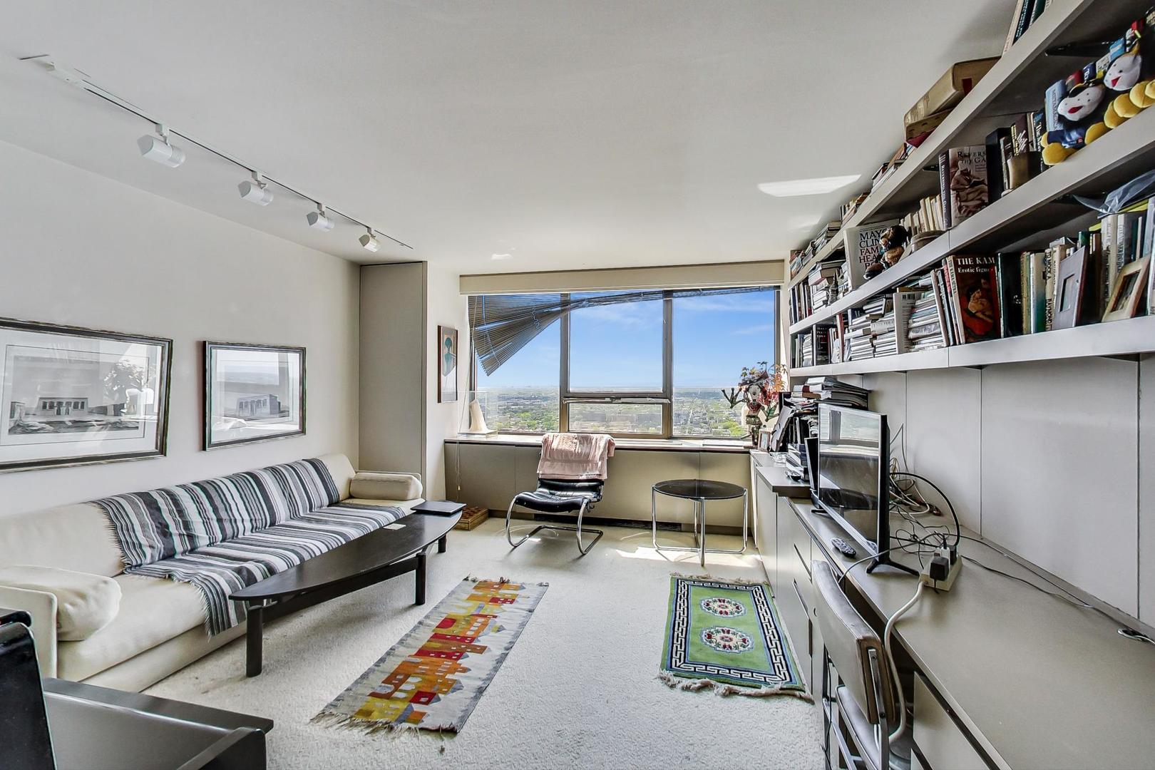 2800 North Lake Shore Drive, Unit 4216 Chicago, IL 60657 - Photo 16 of 29 a living room with furniture