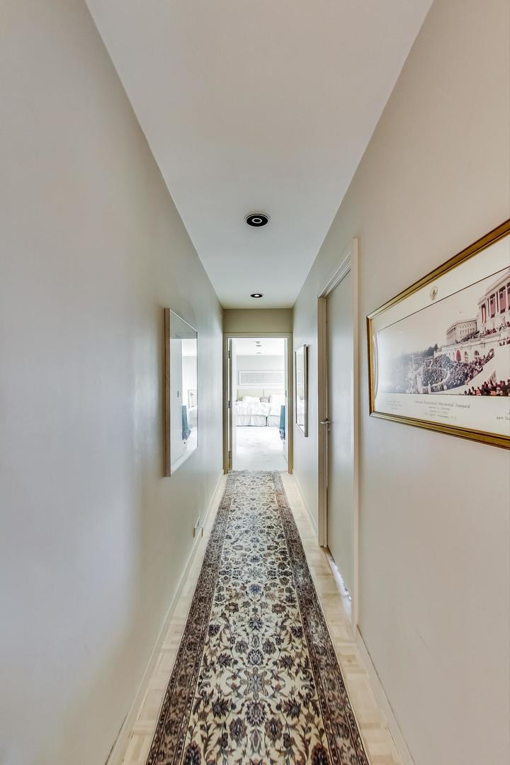 2800 North Lake Shore Drive, Unit 4216 Chicago, IL 60657 - Photo 17 of 29 a view of a hallway view with wooden floor and living room