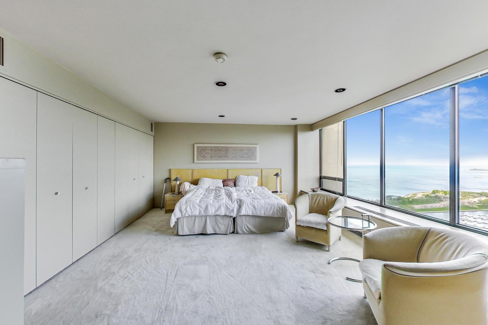 2800 North Lake Shore Drive, Unit 4216 Chicago, IL 60657 - Photo 18 of 29 a bed room with furniture and a large window