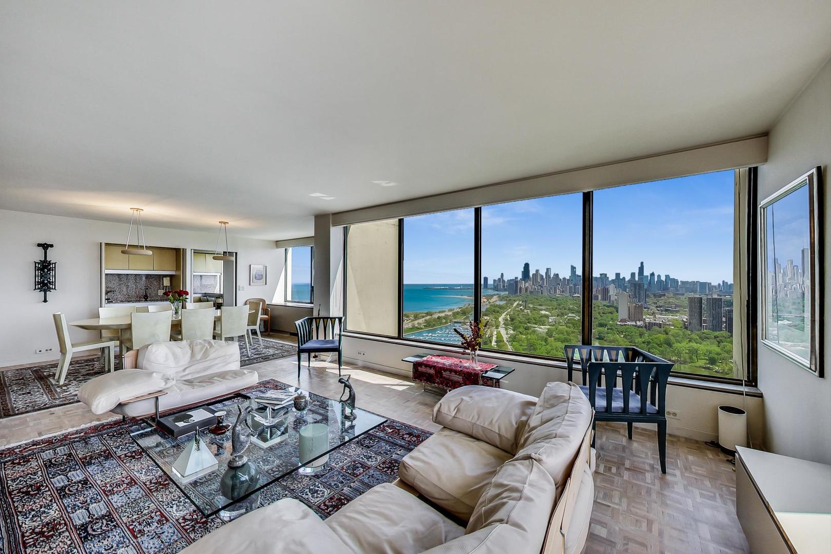 2800 North Lake Shore Drive, Unit 4216 Chicago, IL 60657 - Photo 2 of 29 a living room with furniture and a large window