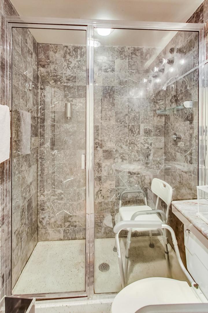 2800 North Lake Shore Drive, Unit 4216 Chicago, IL 60657 - Photo 23 of 29 a bathroom with a toilet and a shower