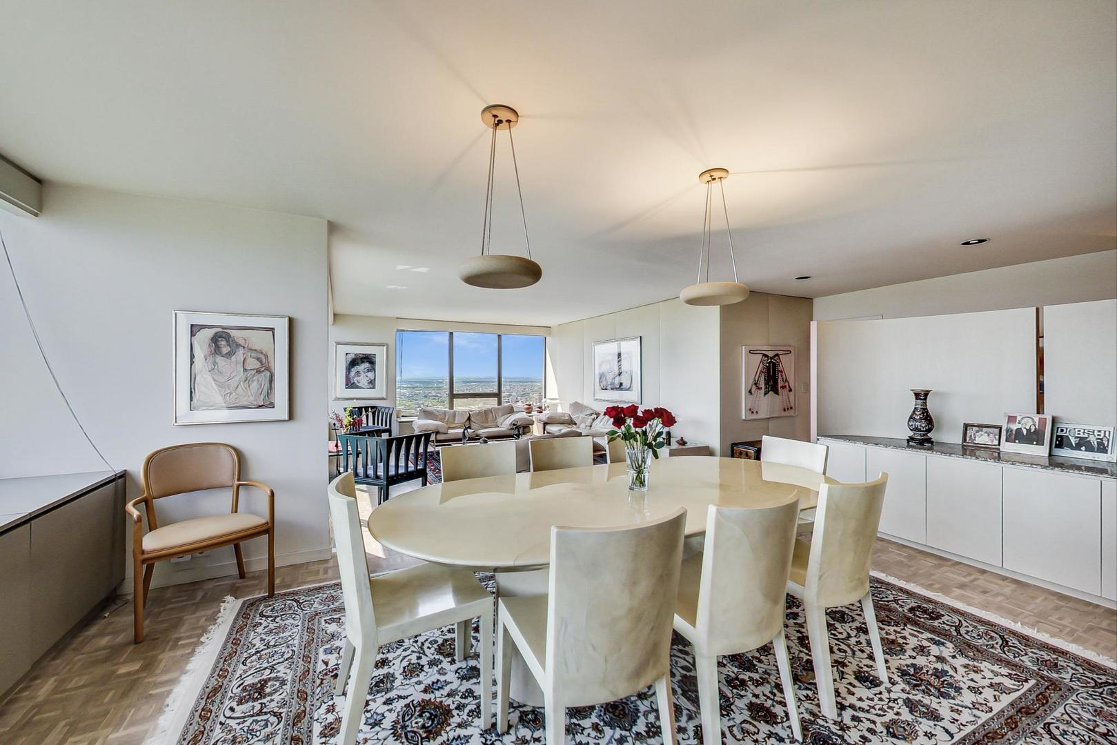 2800 North Lake Shore Drive, Unit 4216 Chicago, IL 60657 - Photo 9 of 29 a view of a dining room with furniture