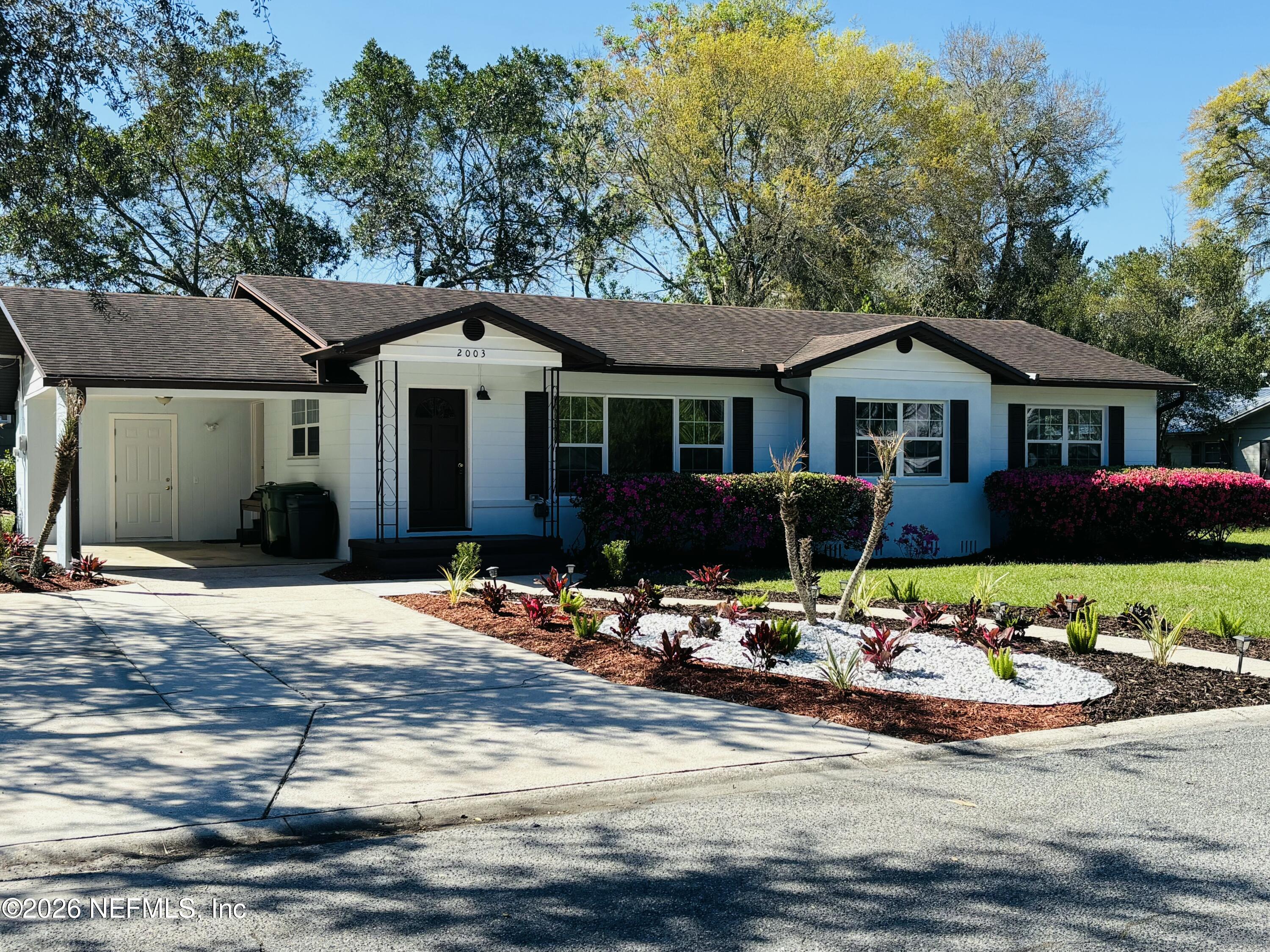 2003 Laurel Street Palatka, FL 32177 - Photo 27 of 31 a front view of a house with cars parked