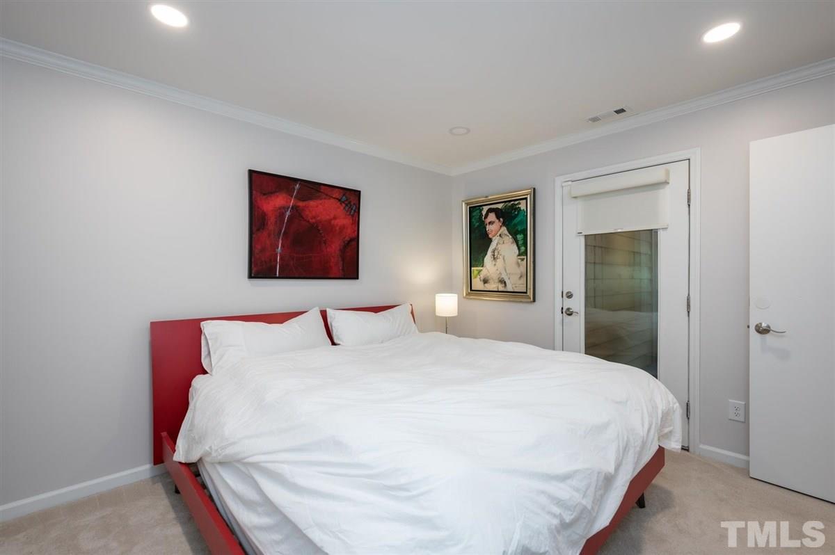 3245 Mill Run, Unit 3245 Raleigh, NC 27612 - Photo 15 of 24 a bedroom with a bed and a painting on the wall