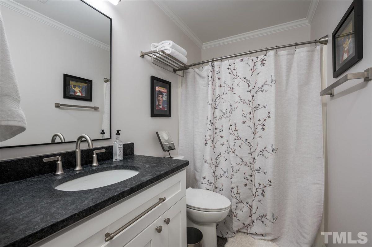 3245 Mill Run, Unit 3245 Raleigh, NC 27612 - Photo 17 of 24 a bathroom with a granite countertop sink and a mirror