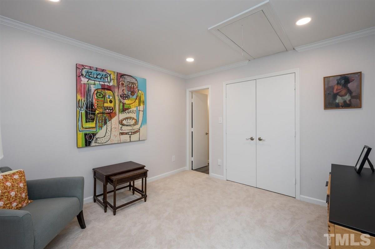 3245 Mill Run, Unit 3245 Raleigh, NC 27612 - Photo 18 of 24 a living room with furniture and a window